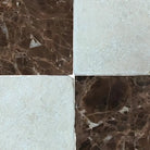 Four square tiles from Checkerboard Emperador Dark Oro Marble and Crema Marfil Set