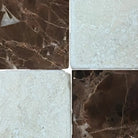 Four square marble tiles from Checkerboard Emperador Dark Oro and Crema Marfil Set