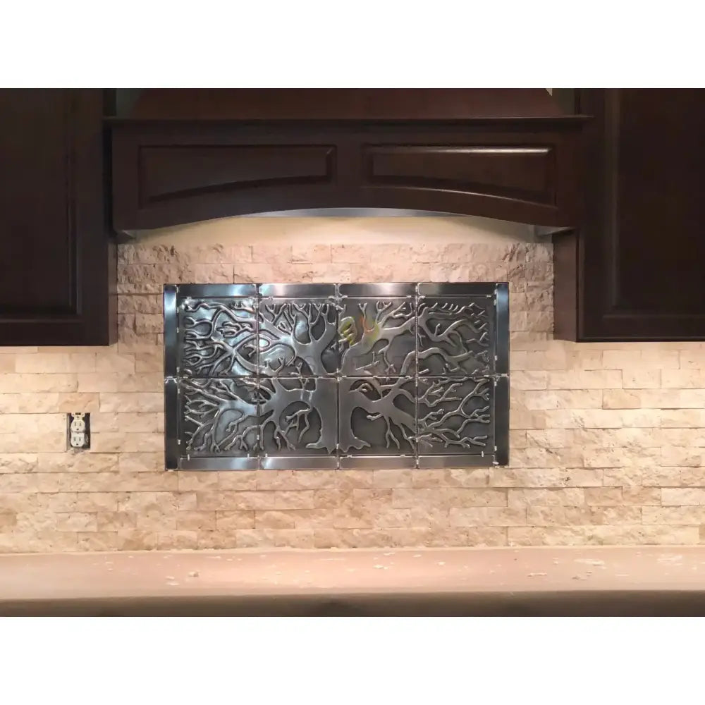Metal tree-themed backsplash from Checkerboard Emperador Dark Oro Marble and Crema Marfil Select Tumbled 6X6 Set
