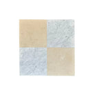 Four square Nero Marquina and Arabescato Corchia marble tiles in a 12x12 set