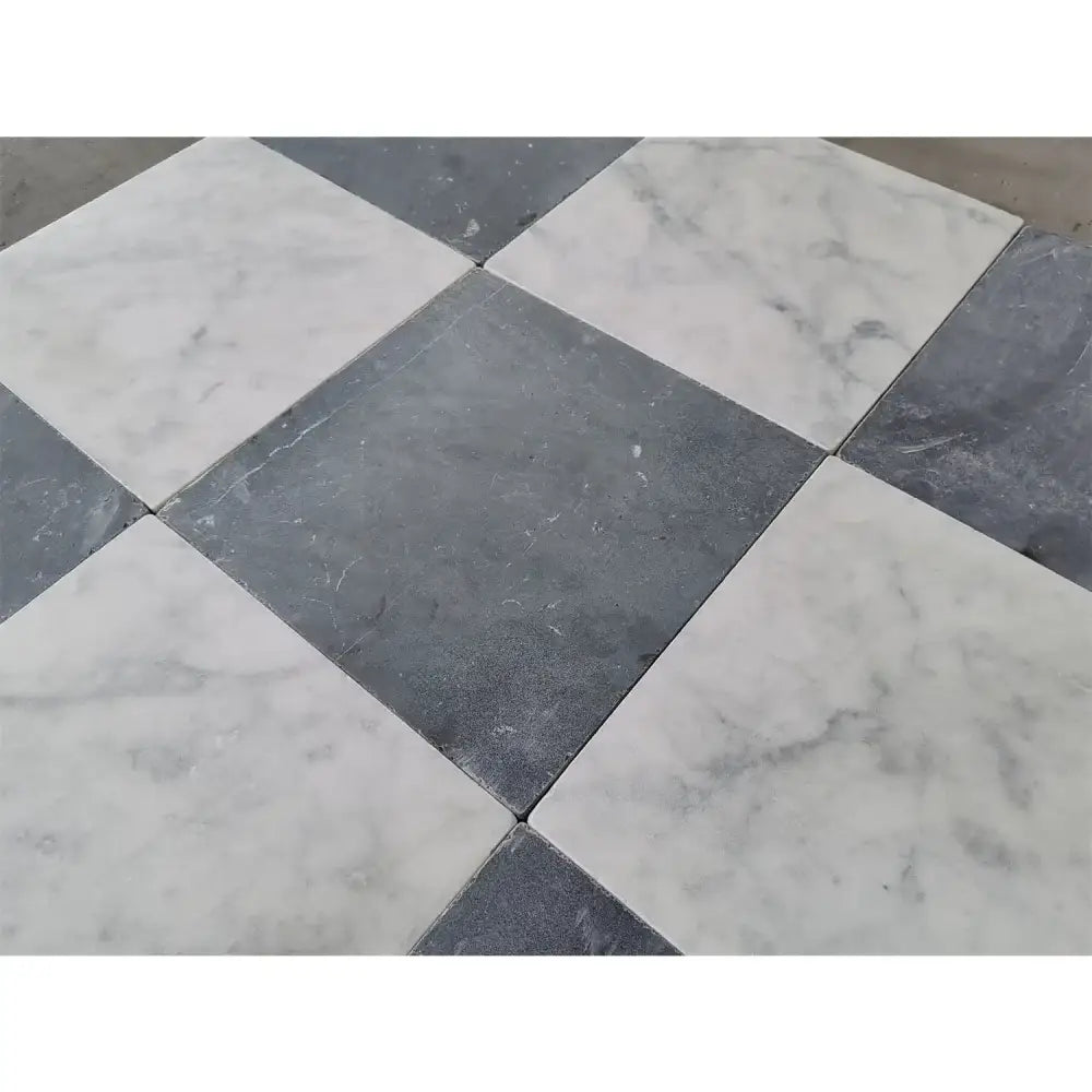 Black and white checkered Nero Marquina and Carrara White marble tiles for elegant flooring