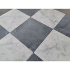 Black and white checkered Nero Marquina and Carrara White marble tiles for elegant flooring