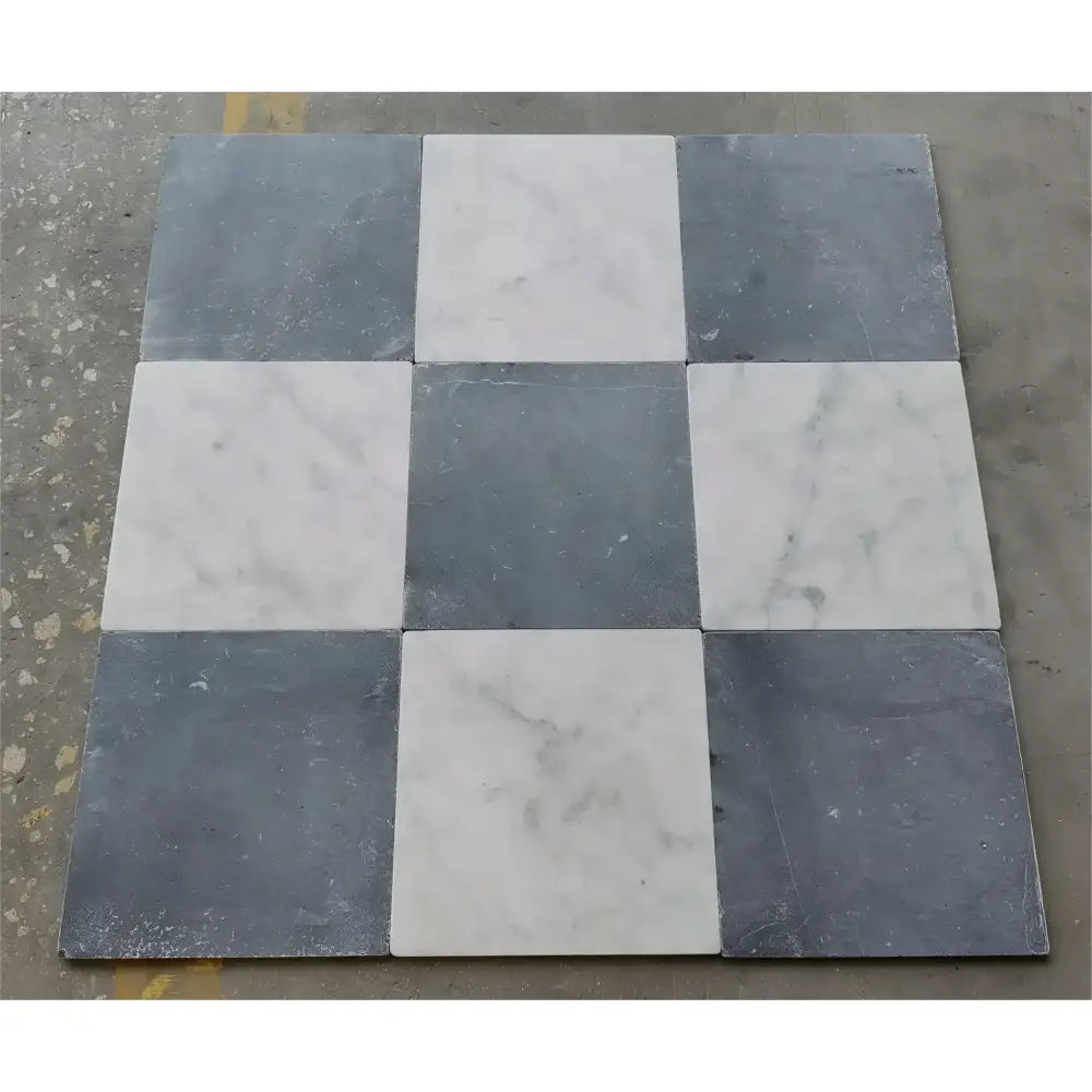 Checkerboard pattern of Nero Marquina and Carrara White marble square tiles