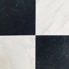 Black and white checkered marble tiles from Checkerboard Oriental White Aurora White Aurora and Nero Marquina Prestige Marble 12X12 set