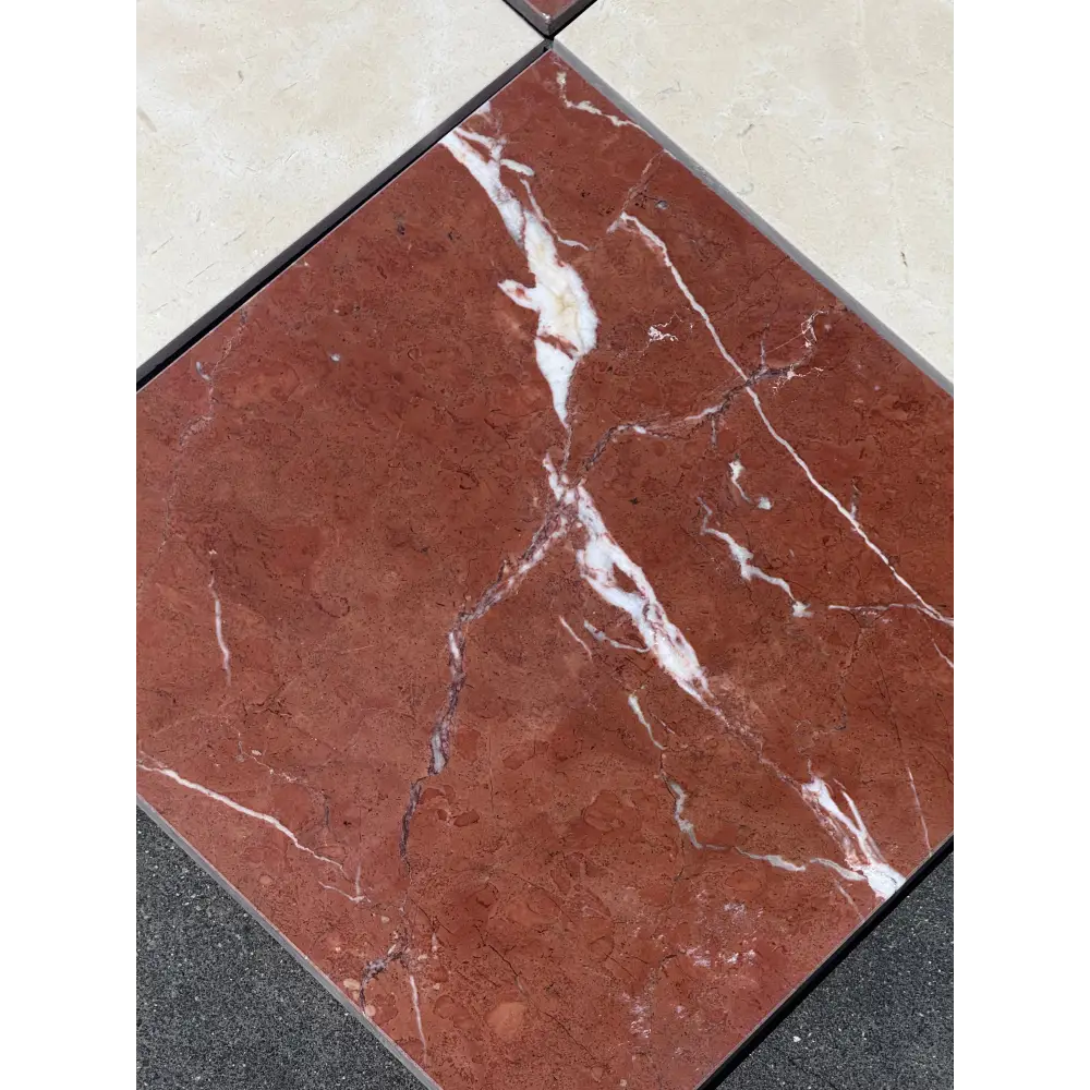 Red marble tile with white veining from Checkerboard Rojo Alicante Select and Crema Marfil Set