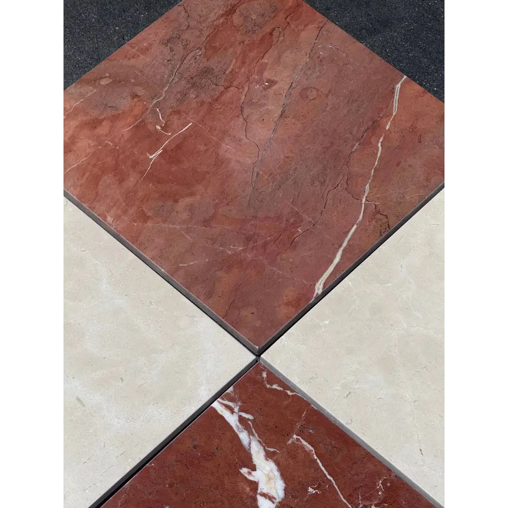 Square marble tiles in red Alicante and Crema Marfil for checkerboard pattern design