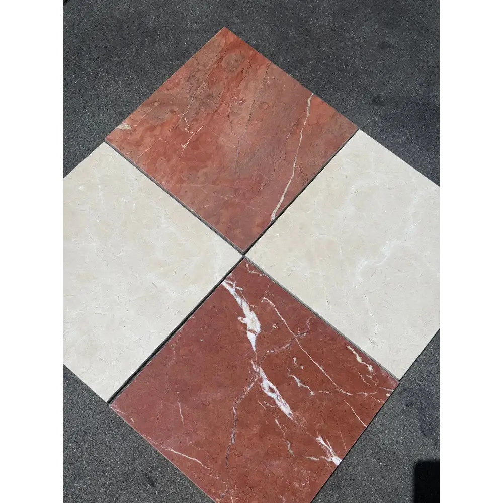 Four square marble tiles in red Alicante and Crema Marfil colors for checkerboard flooring