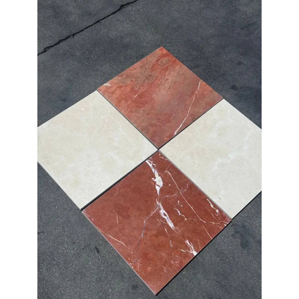 Four square marble tiles in red Alicante and Crema Marfil colors for checkerboard design