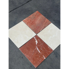 Four square marble tiles in red Alicante and Crema Marfil colors for checkerboard design