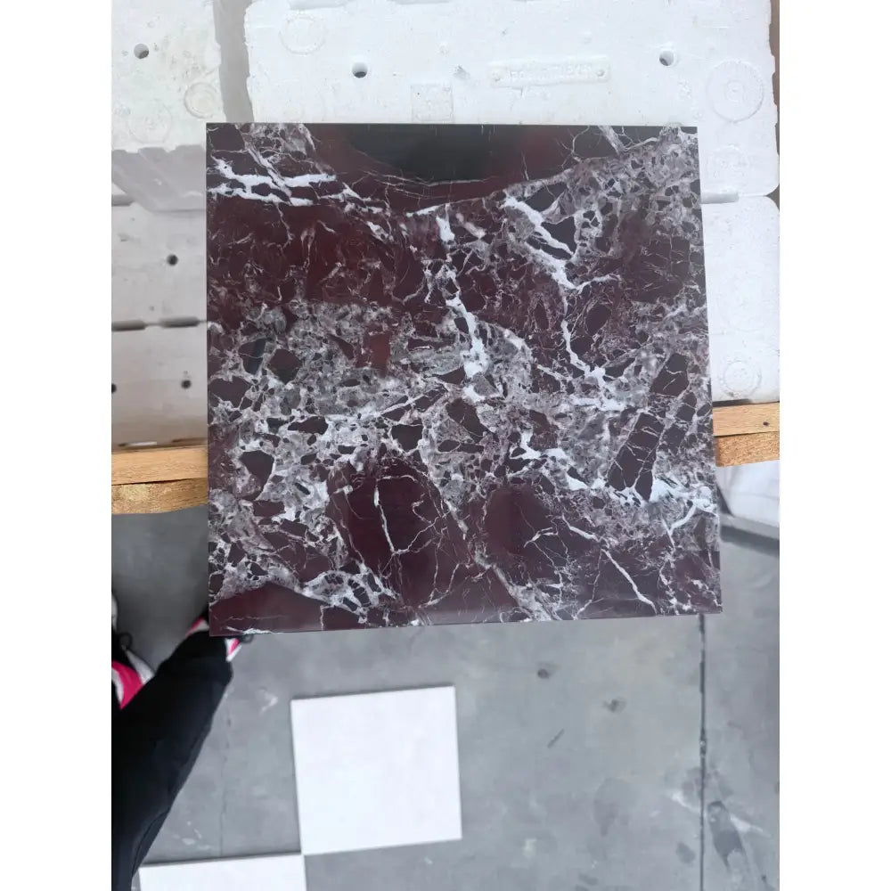 Square marble tile with dark red and white veining from Checkerboard Rosso Levanto and Crema Marfil 12X12 Set