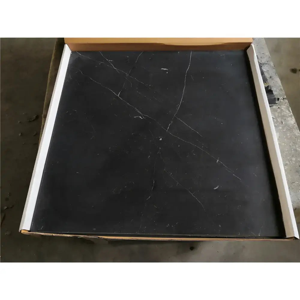Square black tile with white veining from Checkerboard Rosso Levanto and Crema Marfil 12X12 Set