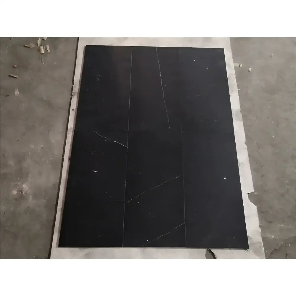 Black marble tile with white veining in Checkerboard Rosso Levanto and Crema Marfil 12x12 Set