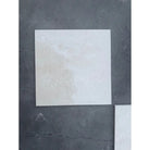 Off-white square tile with subtle marbling for Checkerboard Rosso Levanto and Crema Marfil set