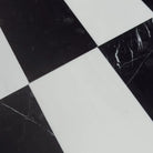 Black and white checkered floor tiles from Como in Dolomite Prestige and Nero Marquina Prestige set