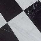 Black and white checkered marble tiles from Como in Carrara White Royale and Nero Marquina Prestige set