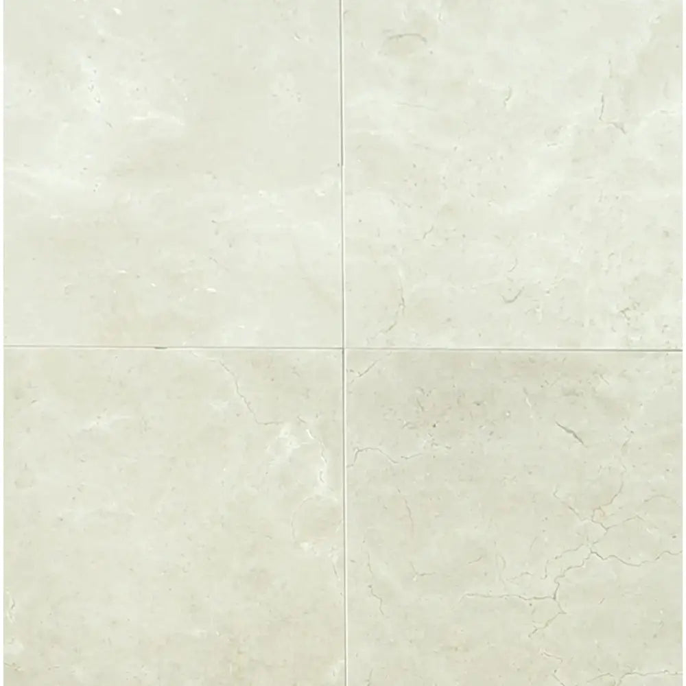 Four light beige Crema Marfil Select Marble tiles in 12x24 size, polished or honed finish