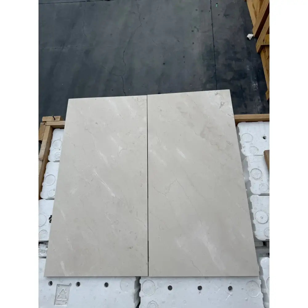 Light-colored Crema Marfil Select Marble 12x24 tiles for polished or honed flooring