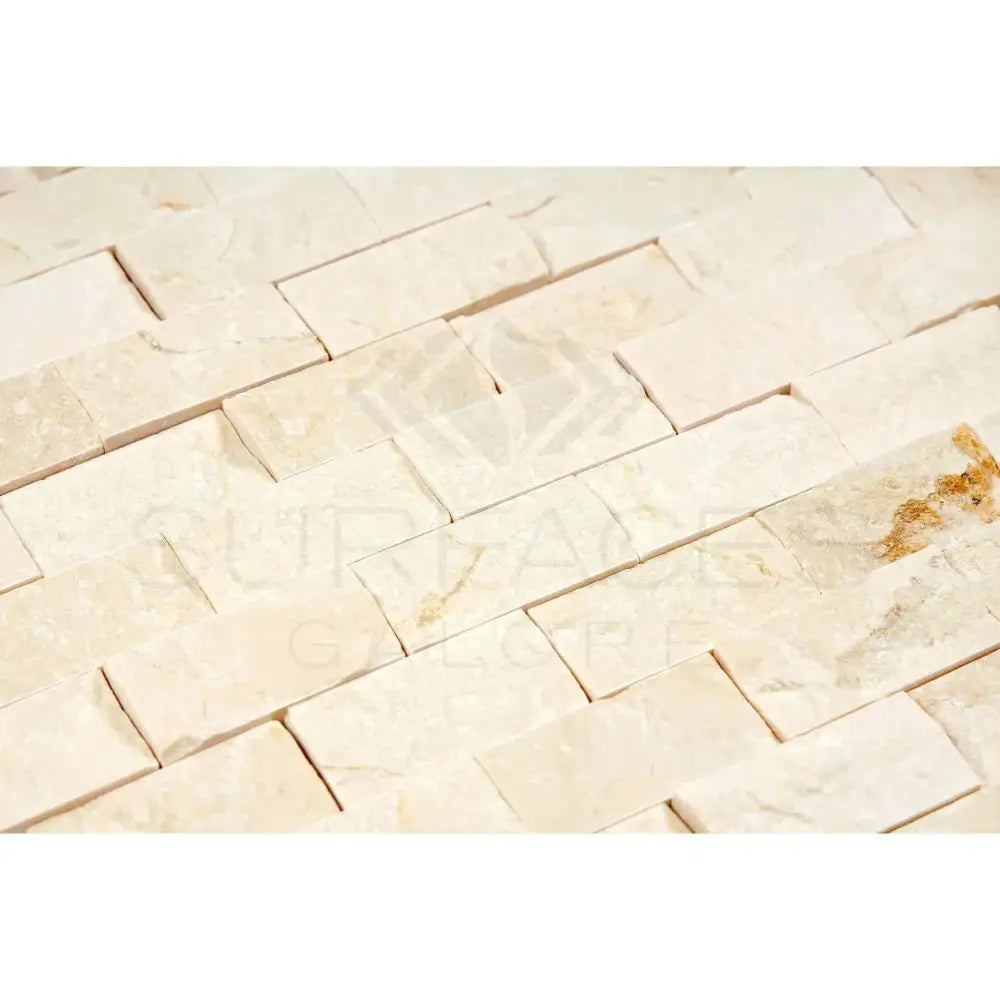Beige stacked stone wall made with Crema Marfil Select Marble 1X2 Brick Mosaic Split-Faced