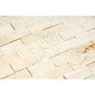 Beige stacked stone wall made with Crema Marfil Select Marble 1X2 Brick Mosaic Split-Faced