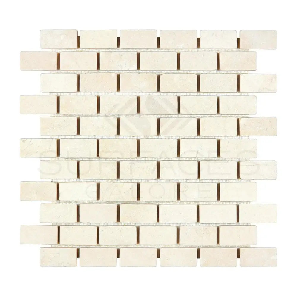 Off-white rectangular mosaic tiles from Crema Marfil Select Marble 1X2 Brick Tumbled display