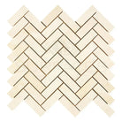 Herringbone pattern of light-colored Crema Marfil Select Marble 1X3 mosaic tiles