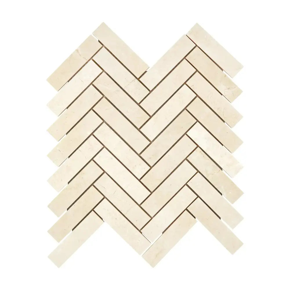Herringbone pattern of light-colored Crema Marfil Select Marble 1x4 mosaic tiles