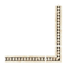 Mosaic tile border from Crema Marfil Select Marble with dark dots and polished finish