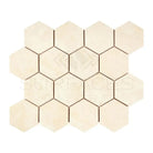 Beige hexagon tile mosaic from Crema Marfil Select Marble 3-inch Tumbled collection