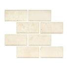 Rectangular off-white Crema Marfil Select Marble 3x6 tiles with deep beveled edges