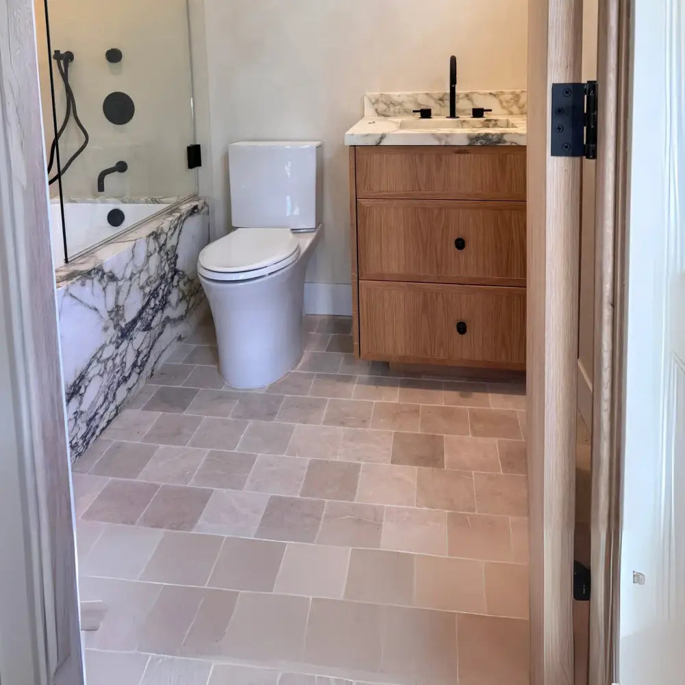 Modern bathroom interior featuring Crema Marfil Select Marble 4X4 polished or honed