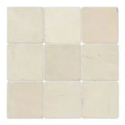 Off-white Crema Marfil Select Marble 4x4 Tumbled tiles arranged in a nine-square pattern
