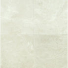 Four light-colored Crema Marfil Select Marble tiles in mini-brick mosaic pattern