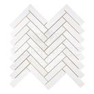 White herringbone tile pattern in Dolomite Prestige 1x4 Herringbone Marble Mosaic