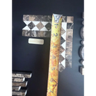 Marble mosaic tile sample featuring Emperador Dark Oro Marble 2X12 bias border and Crema Marfil dots