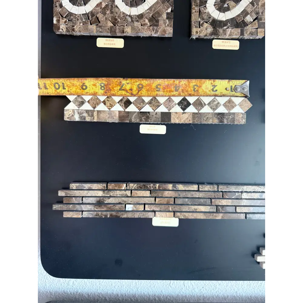Mosaic tile samples with tape measure for Emperador Dark Oro Marble 2X12 Bias Border
