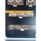 Mosaic tile samples with tape measure for Emperador Dark Oro Marble 2X12 Bias Border