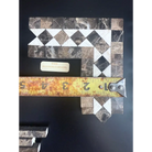 Mosaic tile corner piece from Emperador Dark Oro Marble with Crema Marfil dots