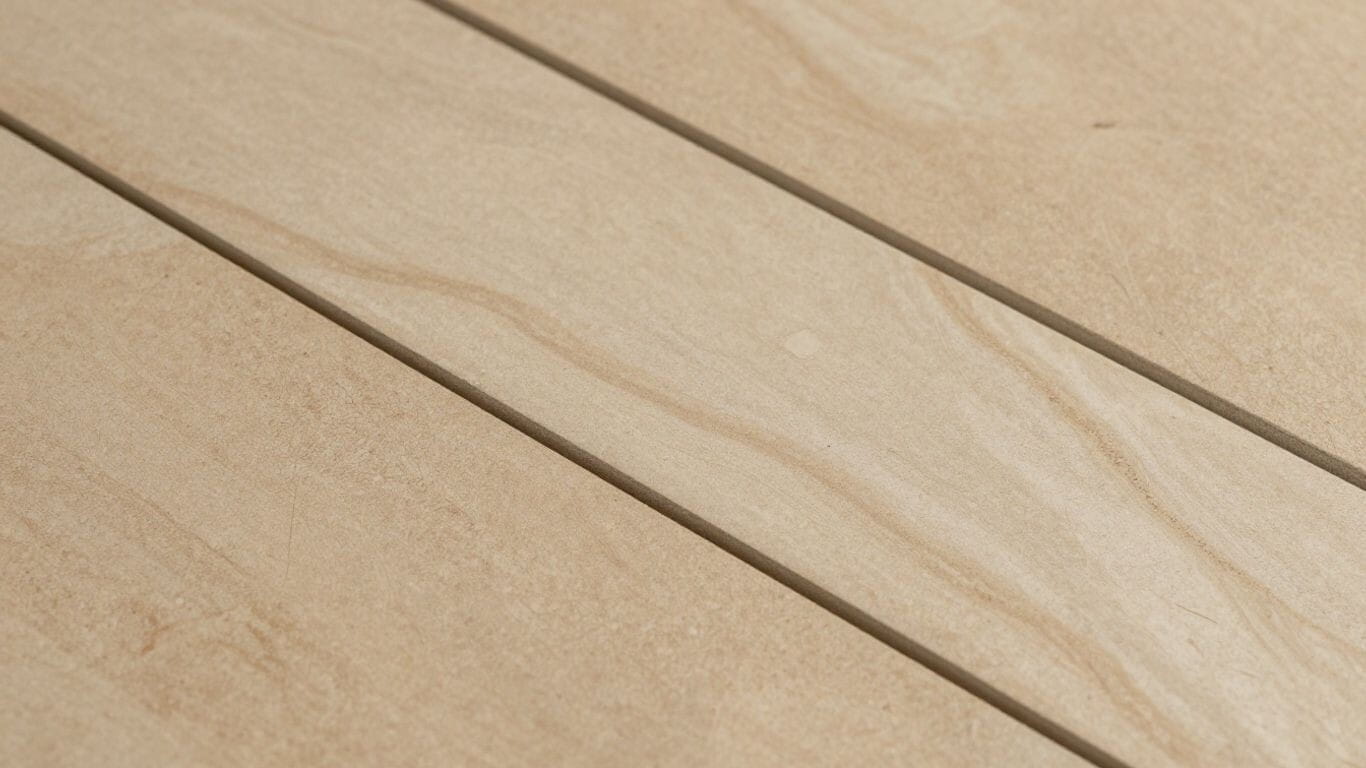 Porcelain tile mimicking travertine texture, warm earthy tones.