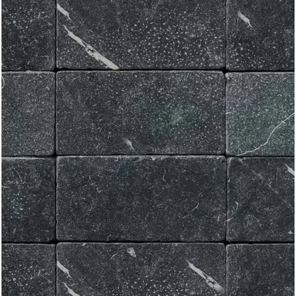 Dark gray marble brick tiles from Nero Marquina/Black Marble 3X6 Tumbled collection