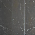 Dark marble tiles with white veining from Nero Marquina Black Marble 4X12 collection