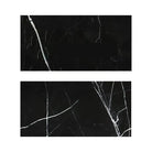 Two black marble tiles with white veining from Nero Marquina Black Marble collection