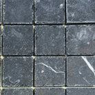 Dark gray square stone tiles from Nero Marquina Prestige Marble 2X2 Tumbled collection
