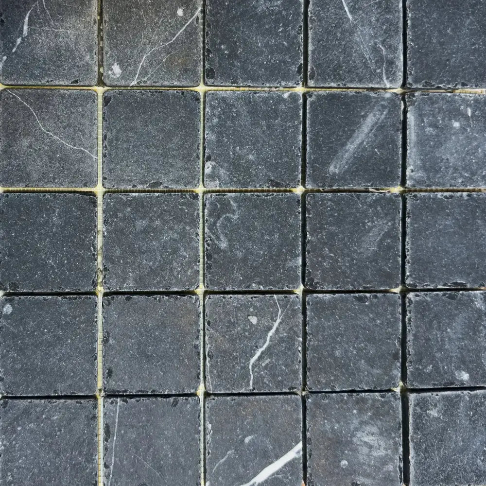 Square gray marble tiles from Nero Marquina Prestige Marble 2X2 Tumbled collection