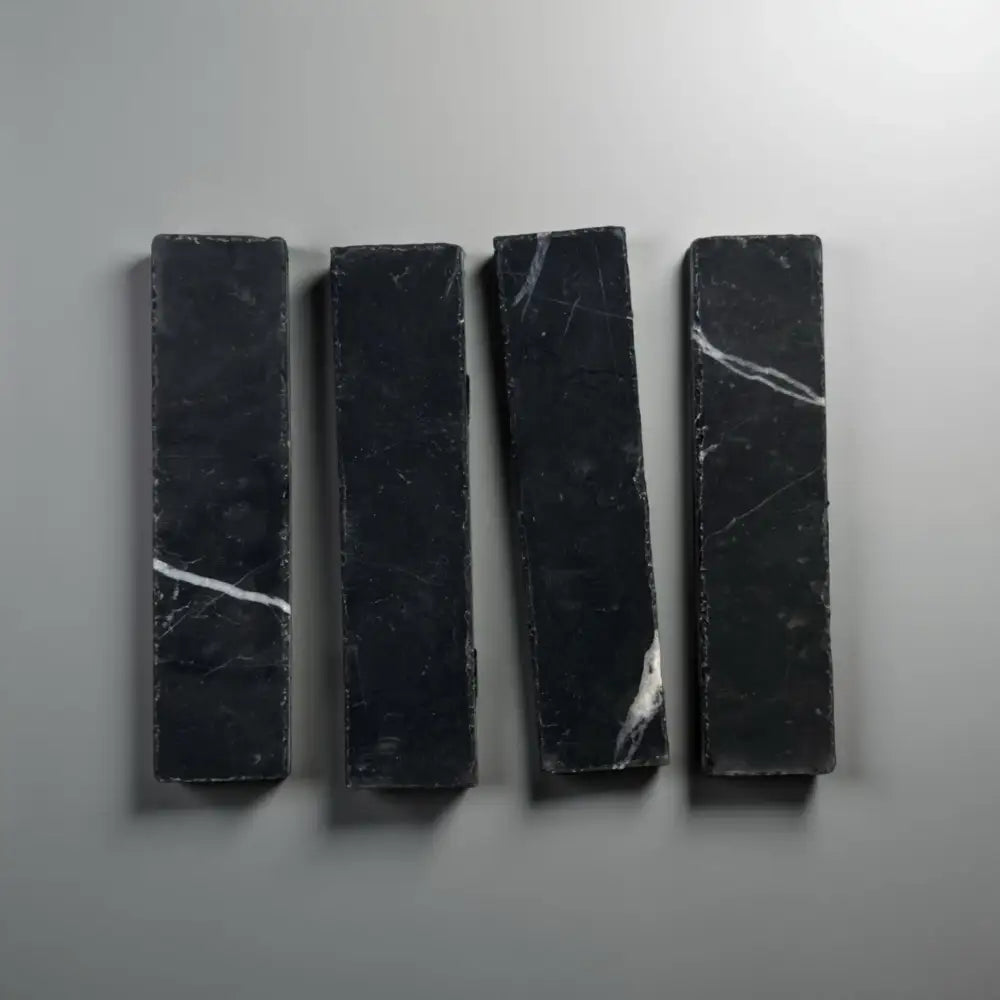 Four black Nero Marquina Prestige Marble rectangles in a mosaic pattern