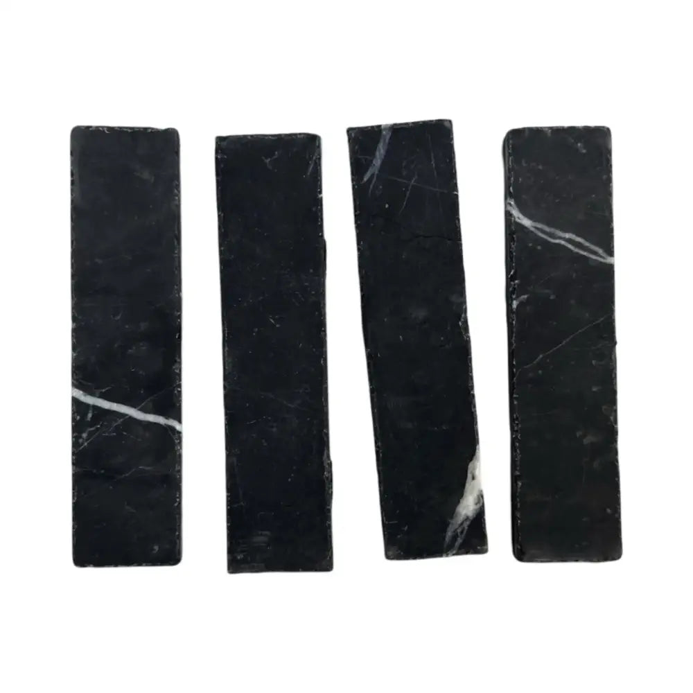 Four black Nero Marquina Prestige Marble rectangles in a 2x8 mosaic pattern