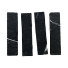 Four black Nero Marquina Prestige Marble rectangles in a 2x8 mosaic pattern