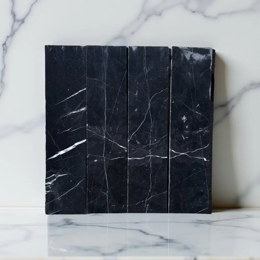 Black Nero Marquina marble tiles with striking white veining for elegant flooring