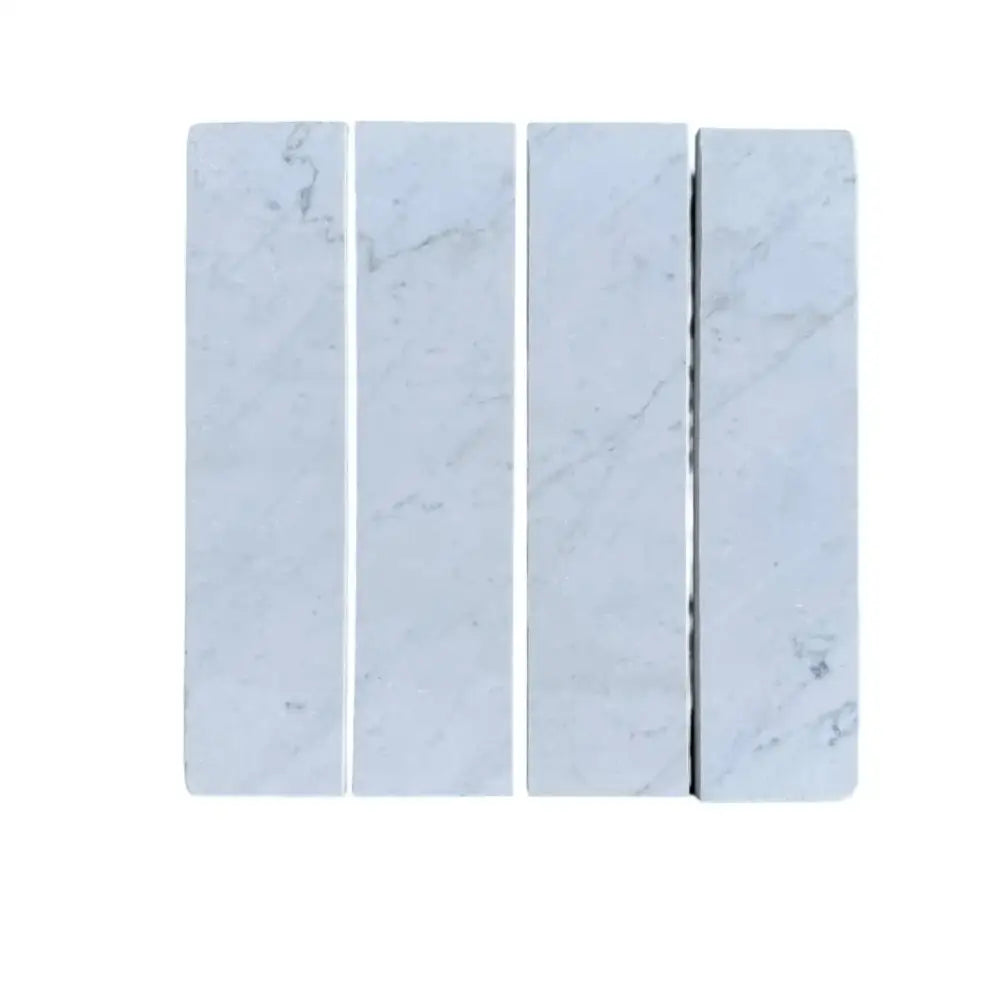Four marble tiles from Oriental White Aurora 3x12 field tile collection