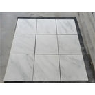 Nine white marble tiles from Oriental White Aurora Asian Statuary 2X2 Marble Mosaic