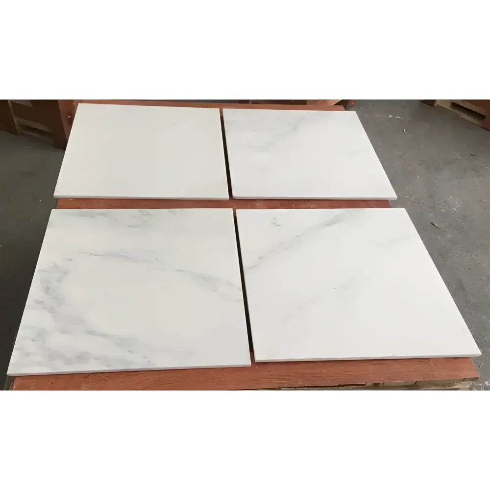 Four square polished or honed Oriental White Aurora Marble tiles for elegant flooring